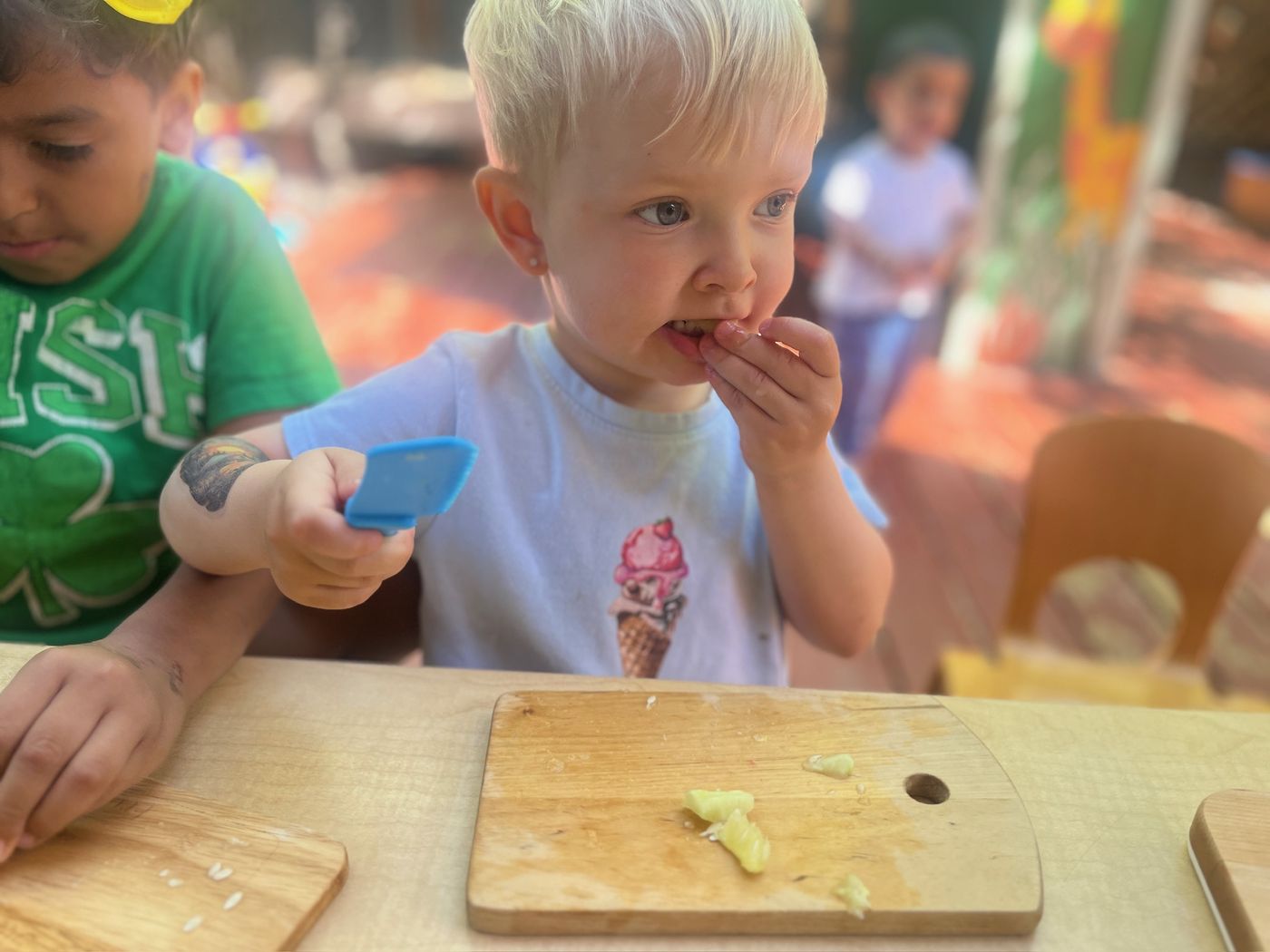 Toddler tasting freshly prepared food