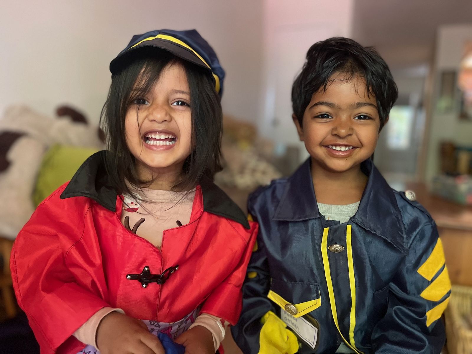 Children in dress-up costumes smiling