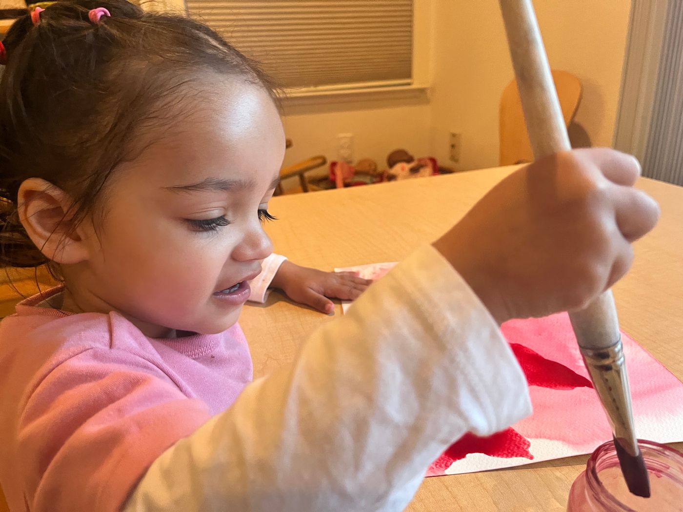 Child practicing wet-on-wet watercolor painting